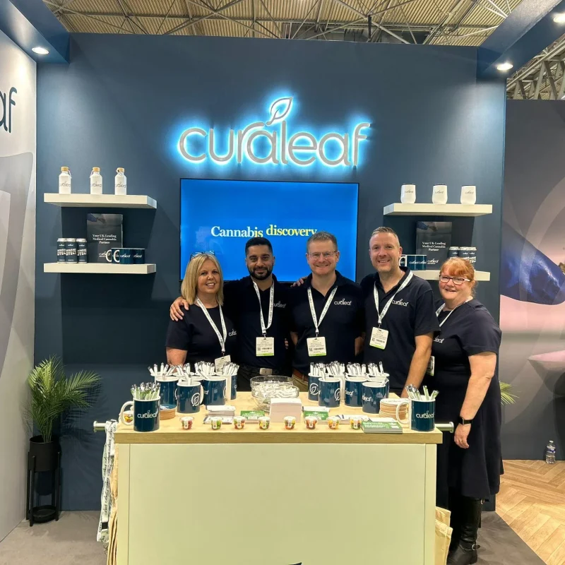 Five members of the Curaleaf team on their exhibition stand